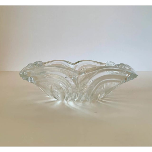 This candy dish has a beautiful shape of petals depicting a flower. Not only are the edges in an irregular pattern making...