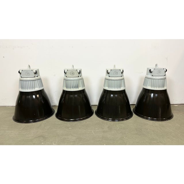 4 industrial black enamel pendant lamps made by Elektrosvit in former Czechoslovakia during the 1970s . White enamel...