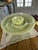 The Round Chartreuse White Opaque Swirl Art Glass Chip & Dip Platter is a beautifully crafted piece of decorative...