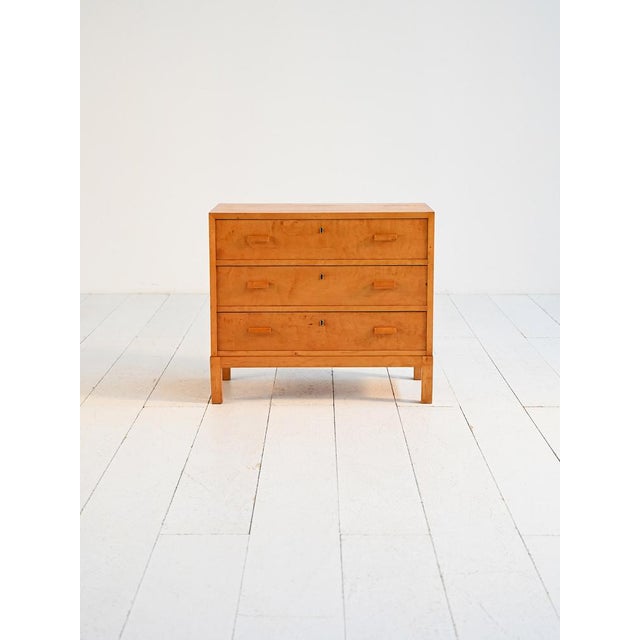 Three-drawer chest of drawers in flamed birch. Northern European production, Art Deco period, 1920s–1930s. Crafted in...