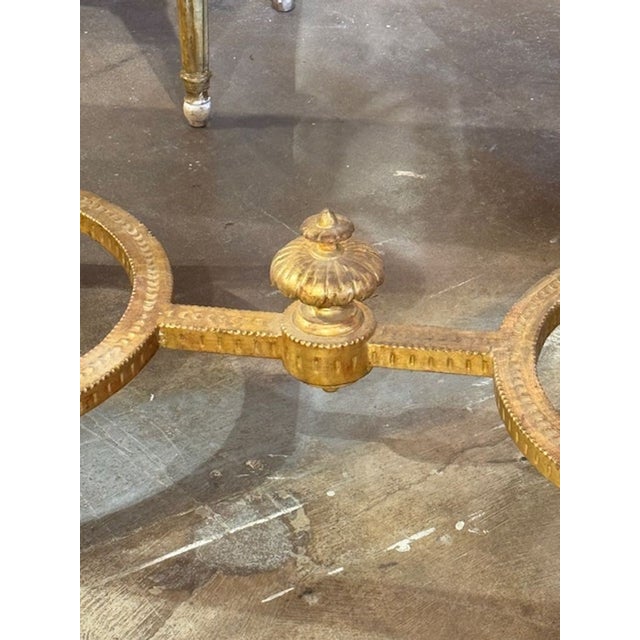 This is a beautiful 19th Century Italian Console Table featuring intricate carvings on a giltwood frame. The table is...