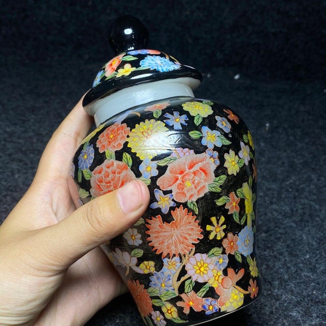 This charming vintage ginger jar is a beautiful example of Chinese-inspired decorative arts. Crafted from glass with a...