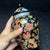 This charming vintage ginger jar is a beautiful example of Chinese-inspired decorative arts. Crafted from glass with a...
