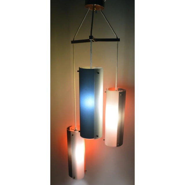 Interesting glass panel cylindrical form three light chandelier. probably Lightolier, after Ponti. Two cylinder shades...