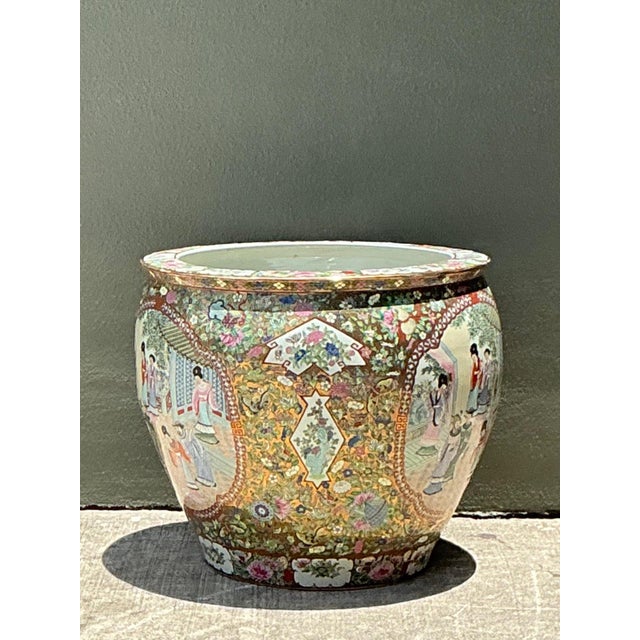 This vintage Chinese Famille Rose planter is a striking example of traditional ceramic artistry, distinguished by its...