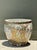 This vintage Chinese Famille Rose planter is a striking example of traditional ceramic artistry, distinguished by its...