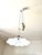 Early 20th-century ceiling pendant light with a "raise and lower" design. White opaline glass shade. This unique ceiling...