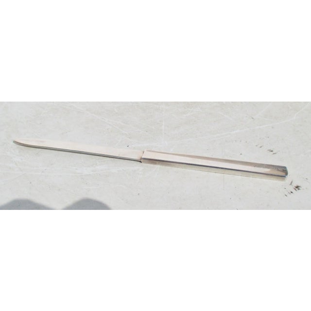 Sterling silver handle and blade. marked 1998 and Tiffany & Co. 925. Pattern 1837. the size is 8" long and .5" wide....