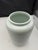 A decorative ceramic Delft apothecary jar featuring the inscription 'Folia Digitalis' and a detailed hand-painted design...