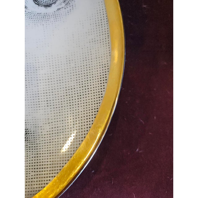 Fornasetti Porcelain Plate, Tema e Variazioni, Pattern No. 39 Atelier Fornasetti, Milan Porcelain with gold accents...