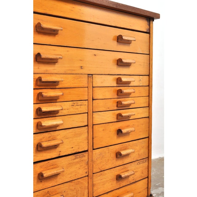 Beautiful beechwood chest of drawers. This heavy, solid school drawer cabinet from the 1950s has 18 drawers and brings a...