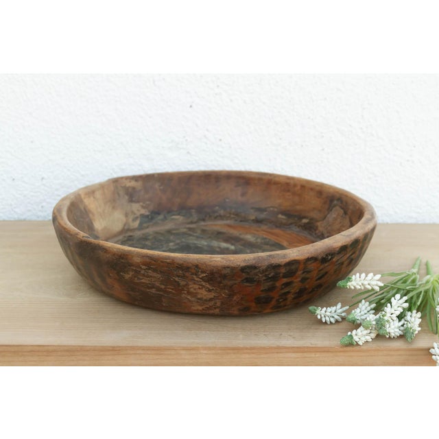 There is a soulful weight to this old wooden bowl that only comes with age. Originally hand-carved and likely used in a...