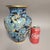 A striking Chinese cloisonné enamel vase featuring the eternal pairing of dragon and phoenix, symbols of harmony and...