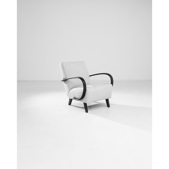 Add a touch of mid-century modern elegance to your home with this 1950s Czech Wooden Armchair by J. Halabala. Renowned for...
