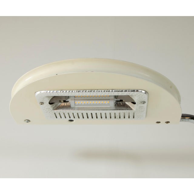 The Mezzaluna floor lamp, designed by Bruno Gecchelin in the 1970s for Italian manufacturer Skipper, is a sleek and...