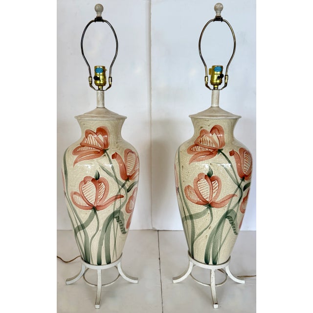 Large and impressive pair of ceramic table lamps on metal stands. Beautiful salmon and green painted flowers with leaves...