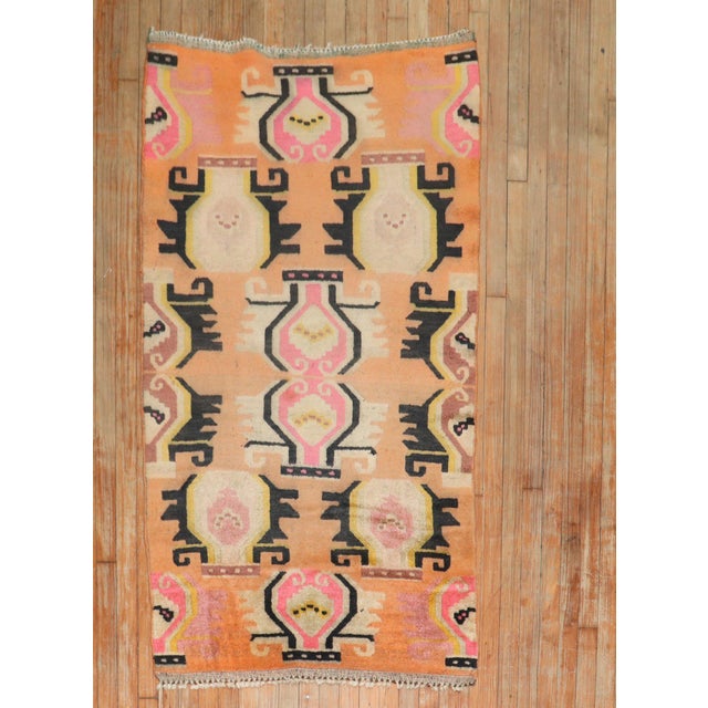 Colorful one-of-a-kind Tibetan rug from the 2nd quarter of the 20th century feauturing a bright orange field Measures:...