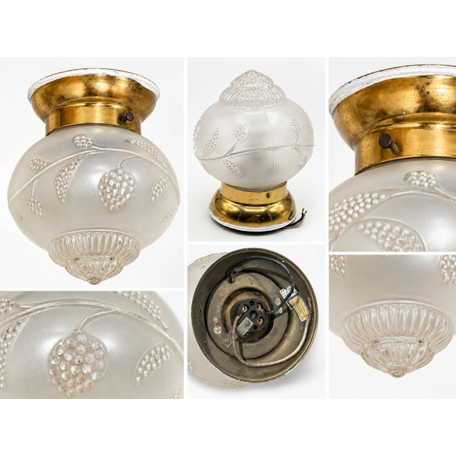 This vintage flush-mount ceiling light has a distinctive Art Deco / early 20th-century character. This compact ceiling...