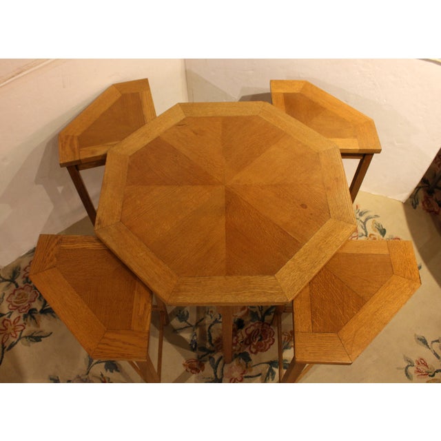 Circa 1970s Mid Century Modern coffee table & nesting tables set, English. Oak. Octagonal coffee table with 4 modified...