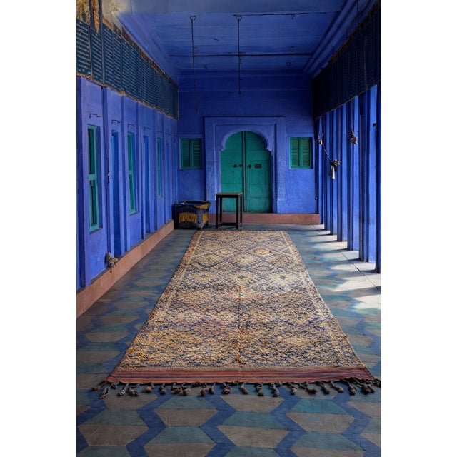 This exceptional large vintage Moroccan Talsint rug originates from the Aït Bouchaoun area, in southeastern Morocco, a...