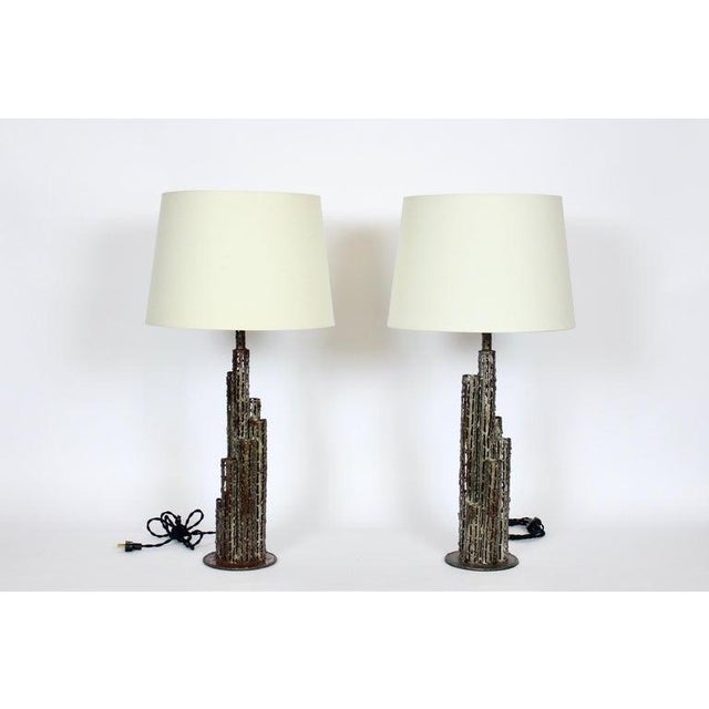 Tall pair of Marcello Fantoni handcrafted Torch Cut Steel Table Lamps, 1950's. Featuring open pierced, welded and sealed...