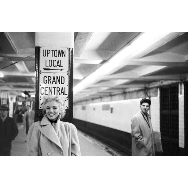 By photographer Ed Feingersh, actress Marilyn Monroe takes the subway in Grand Central Station on March 24, 1955 in New...