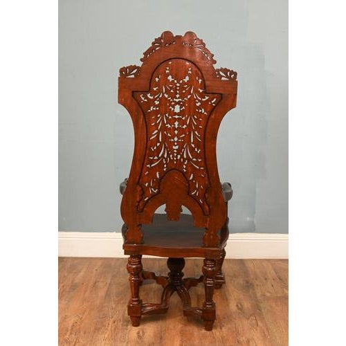 Very decorative pair of heavily carved solid oak hall chairs in the Jacobean revival taste Exceptional pierced backrests...