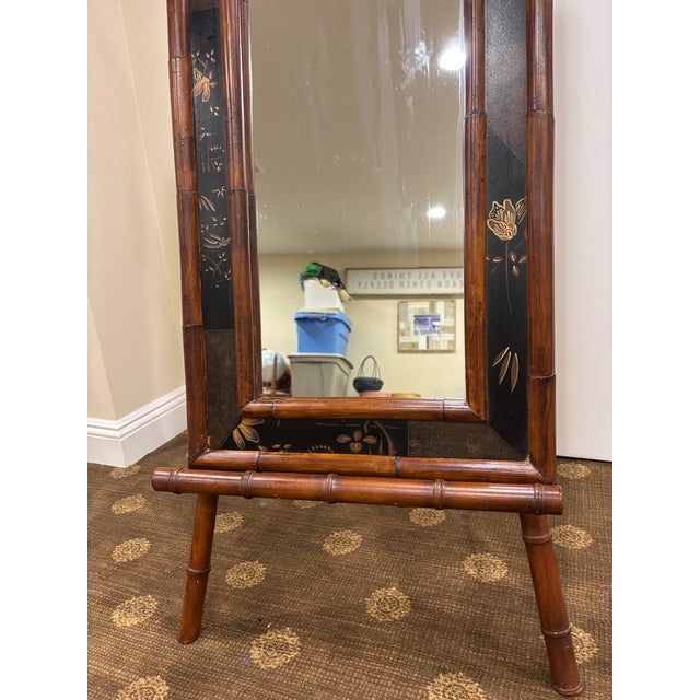 A lovely Asian inspired delicate floral?butterfly design on black surrounded by a bamboo frame. The mirror is in excellent...