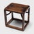 The streamlined form of this low Chinese side table draws from the austere designs of Ming-dynasty furniture. Lightweight...