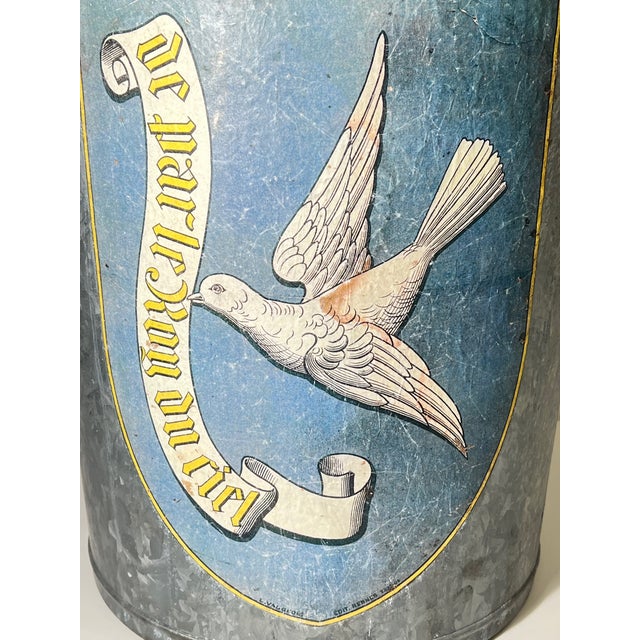 Fabulous large vintage French zinc bucket featuring an applied paper decorative image of a flying dove holding a banner on...