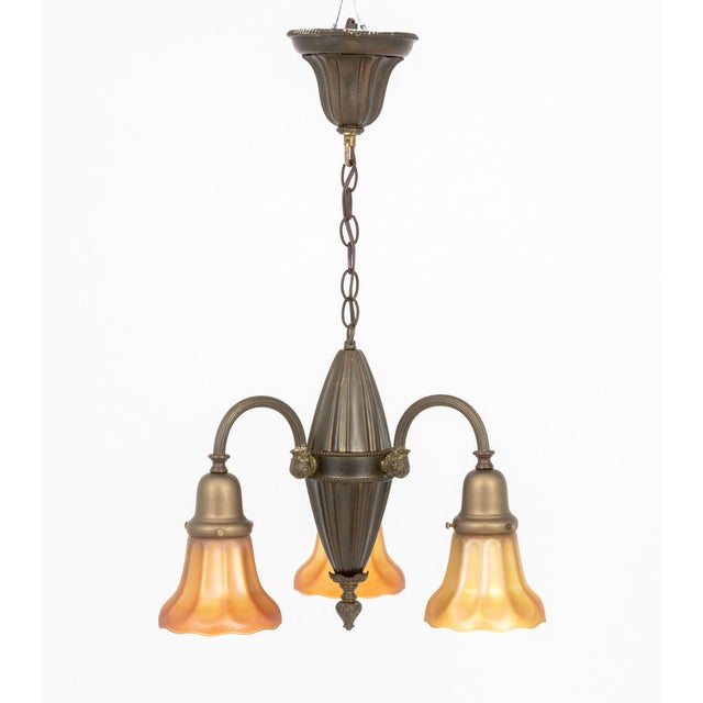 Victorian Brass and Favrile Style Glass Three-Branch Chandelier, with golden iridescent glass shades. 25" H x 15"...