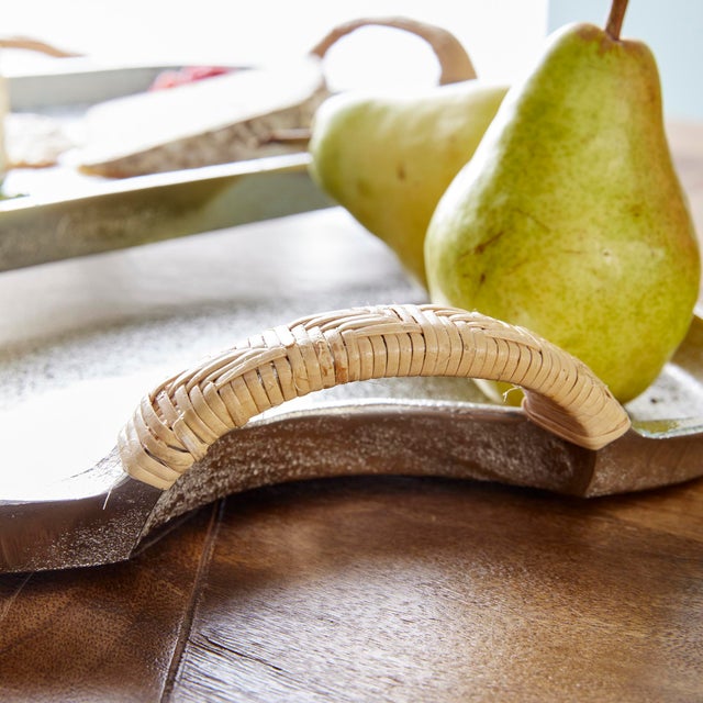 Made of cast aluminum in a warm silver finish, these modern trays have natural rattanwrapped handles. Sit atop a kitchen...
