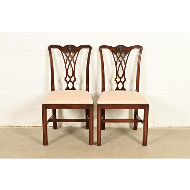 An outstanding pair of Georgian or Chippendale style side chairs or dining chairs In the manner of Baker Furniture USA,...