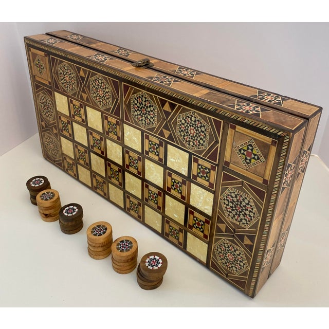 Stunning mosaic Backgammon set featuring a traditional Syrian style design and fine craftsmanship. Made in Morocco. The...