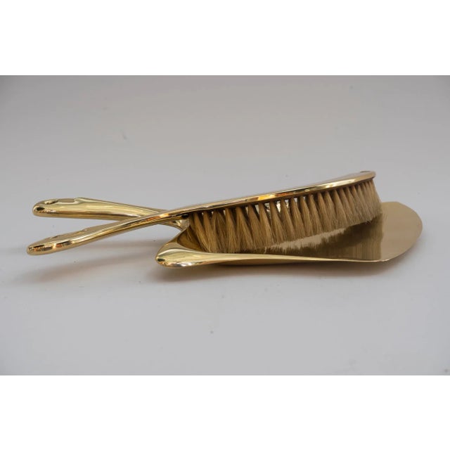 Art Deco cleaning set, Vienna, circa 1920s. Brass polished and stove enameled.