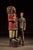 Monumental hand-carved and painted wooden figure depicting a Native American chief in traditional attire, executed in the...