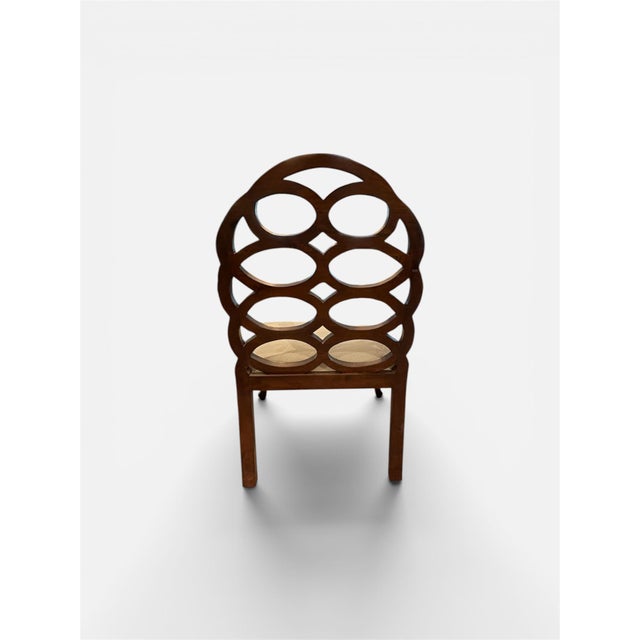 A pair of Loop chairs inspired by the iconic design of Francis Elkins, one of the most influential American decorators of...