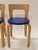 Artek 65 chairs, 4 pieces, birch with original blue artificial leather upholstery. Designer Alvar Aalto. The chairs are...