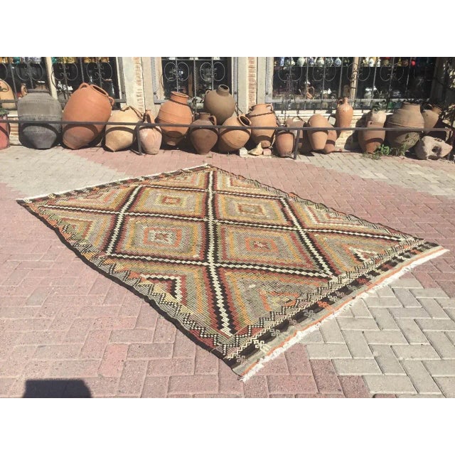 This beautiful, vintage, handwoven kilim is approximately 50 years old. It is handmade, of very fine quality hand spun...