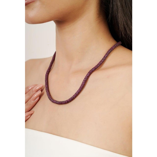 This elegant necklace is expertly crafted in solid 925 sterling silver and adorned with natural rubies set in a...