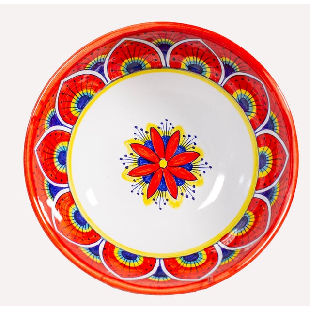 The Intreccio Red Deep Pasta &amp; Soup Bowl brings centuries of Italian ceramic artistry to your table. Hand-painted by...