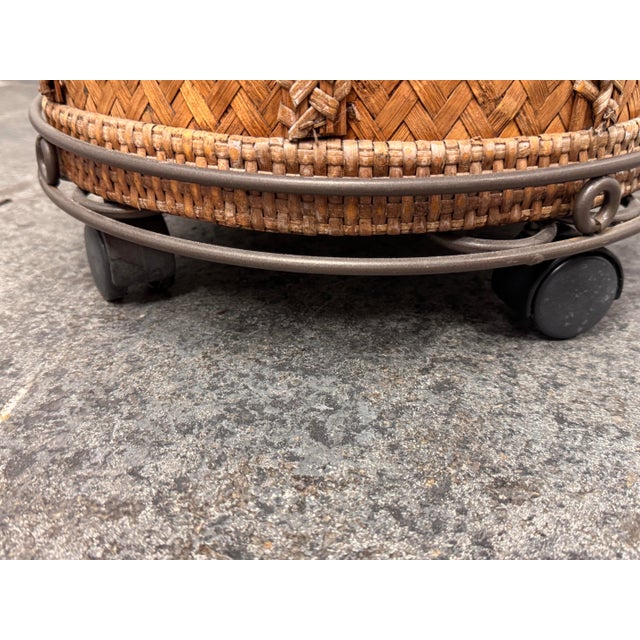 Design Plus Gallery presents a Vintage Woven Rattan Drum Table + Glass Top. The cylindrical frame displays herringbone...