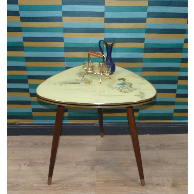 A real eye-catcher! beautiful side table/coffee table cocktail table on tapered legs with metallic-colored ends...