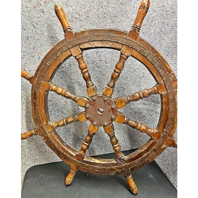 Well used and distressed but solid vintage ship's spoke wooden wheel with steel rims and hub, 8 turned spokes and handles...
