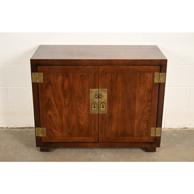 A gorgeous mid-century modern Hollywood Regency Campaign style buffet server or bar cabinet By Henredon USA, Circa 1980s...