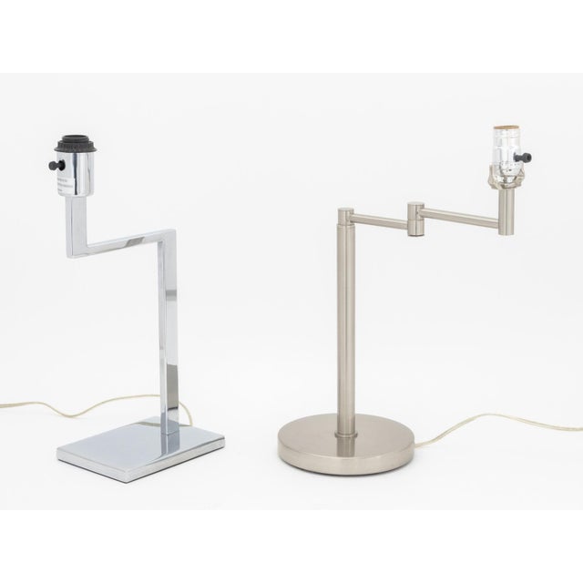 Two Contemporary Silver-Tone Metal and Chrome Desk Lamps, one with L-form base, other with articulating arm on circular...