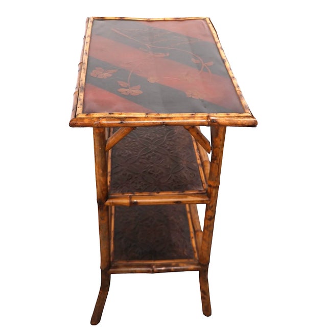 Charming Victorian English Chinoiserie style side, or end table, having a orange / brown toned lacquer top depicting birds...
