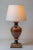 This elegant 20th-century French lamp features a beautifully crafted base with a rich, earthy marbled finish that exudes a...