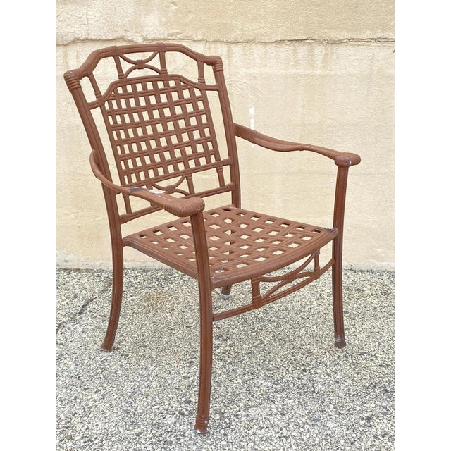 Cast Aluminum Basket Weave Lattice Rattan Patio Outdoor Pool Arm Chair. Circa Late 20th Century. Measurements: 36.5" H x...
