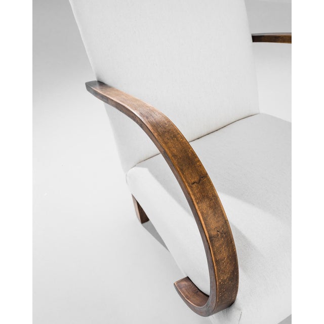 Add a touch of Art Deco elegance to your home with this stunning 1930s Czech Wooden Armchair by J. Halabala. Renowned for...